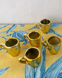 Små guldiga koppar DessinDesign