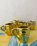 Små guldiga koppar DessinDesign