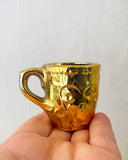 Små guldiga koppar DessinDesign