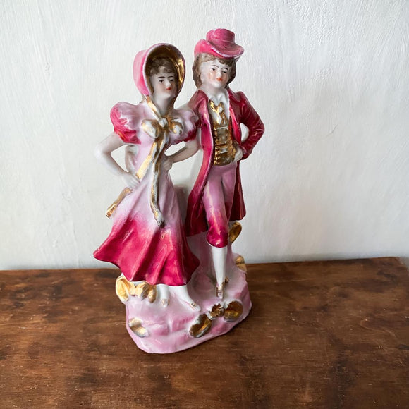 Vintage porcelain figurine of stylish couple